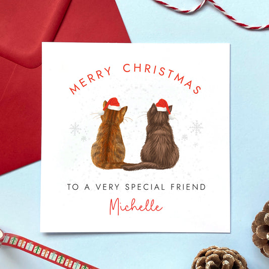 A personalised two cats Christmas card for Friend.