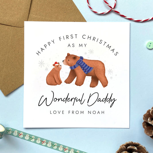 A personalised bears first Christmas as my Daddy card. It features a cute illustration of a brown bear and baby bear. It can be personalised with any child's name, and makes an ideal Christmas card for Dad from baby Son or Daughter on their 1st Christmas as a dad.