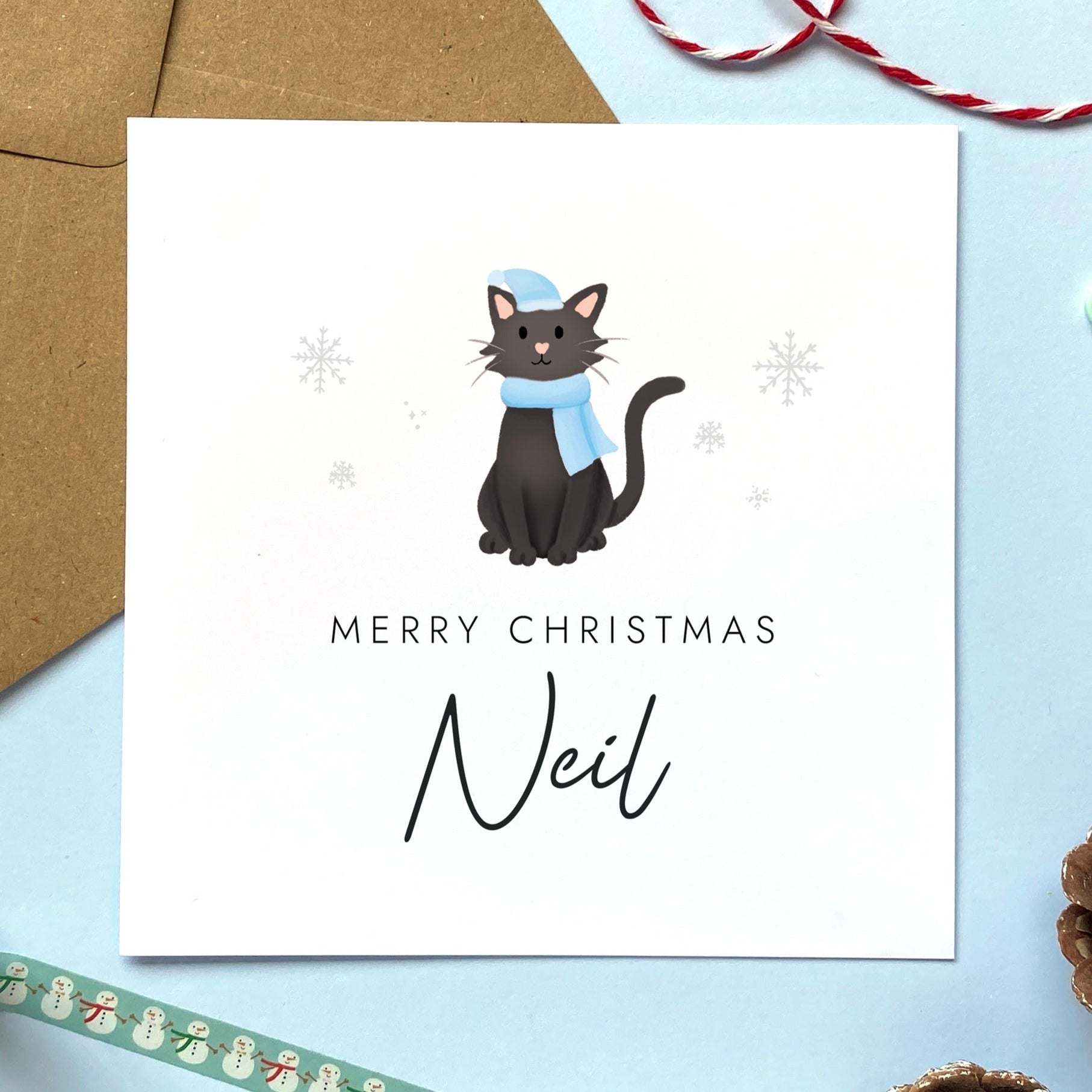 A personalised Christmas card for Him featuring a black cat. It can be personalised by adding a name or relation. It's designed as a special Christmas card for male relations such as Son, Husband, Brother, Grandson and Dad.