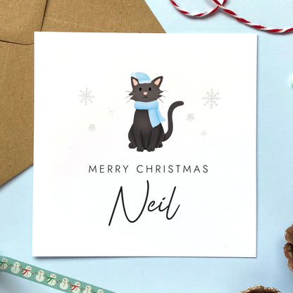 A personalised Christmas card for Him featuring a black cat. It can be personalised by adding a name or relation. It's designed as a special Christmas card for male relations such as Son, Husband, Brother, Grandson and Dad.
