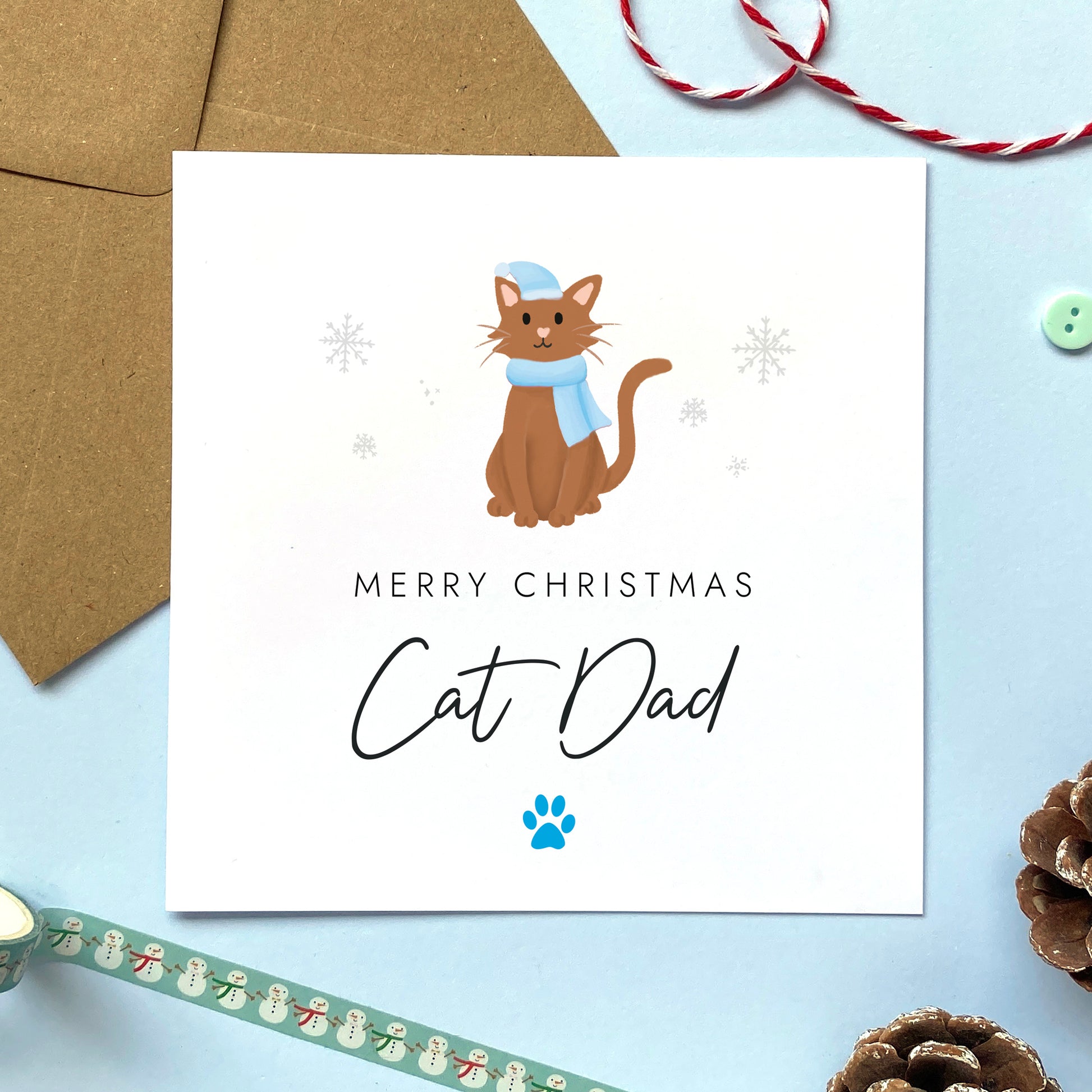 A personalised Christmas card for Cat Dad featuring a brown cat. It can be personalised by changing the relation and the cat. It's designed as a special Christmas card from the cat.