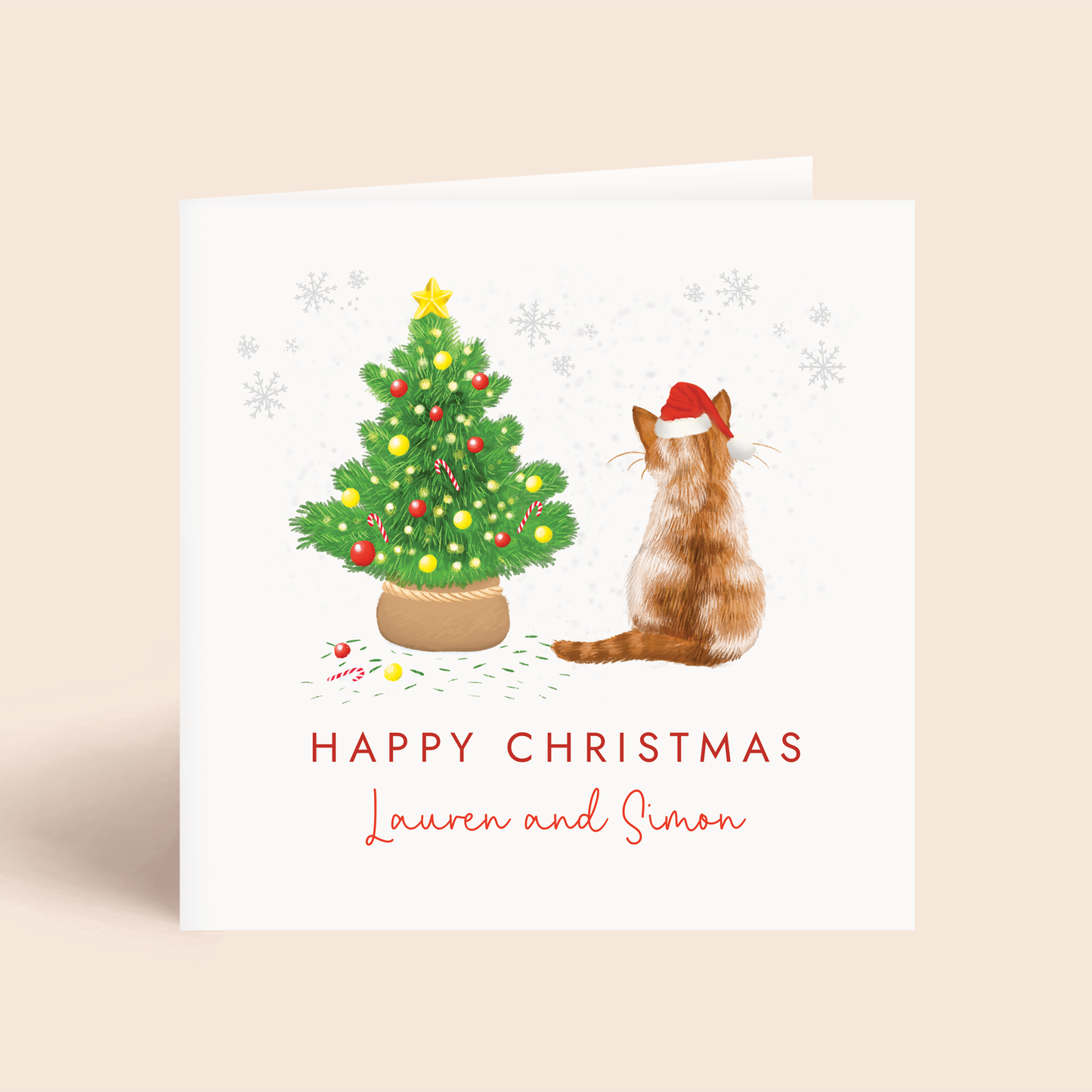 Personalised Cat Christmas card with a ginger and white tabby cat and decorated tree on a beige background