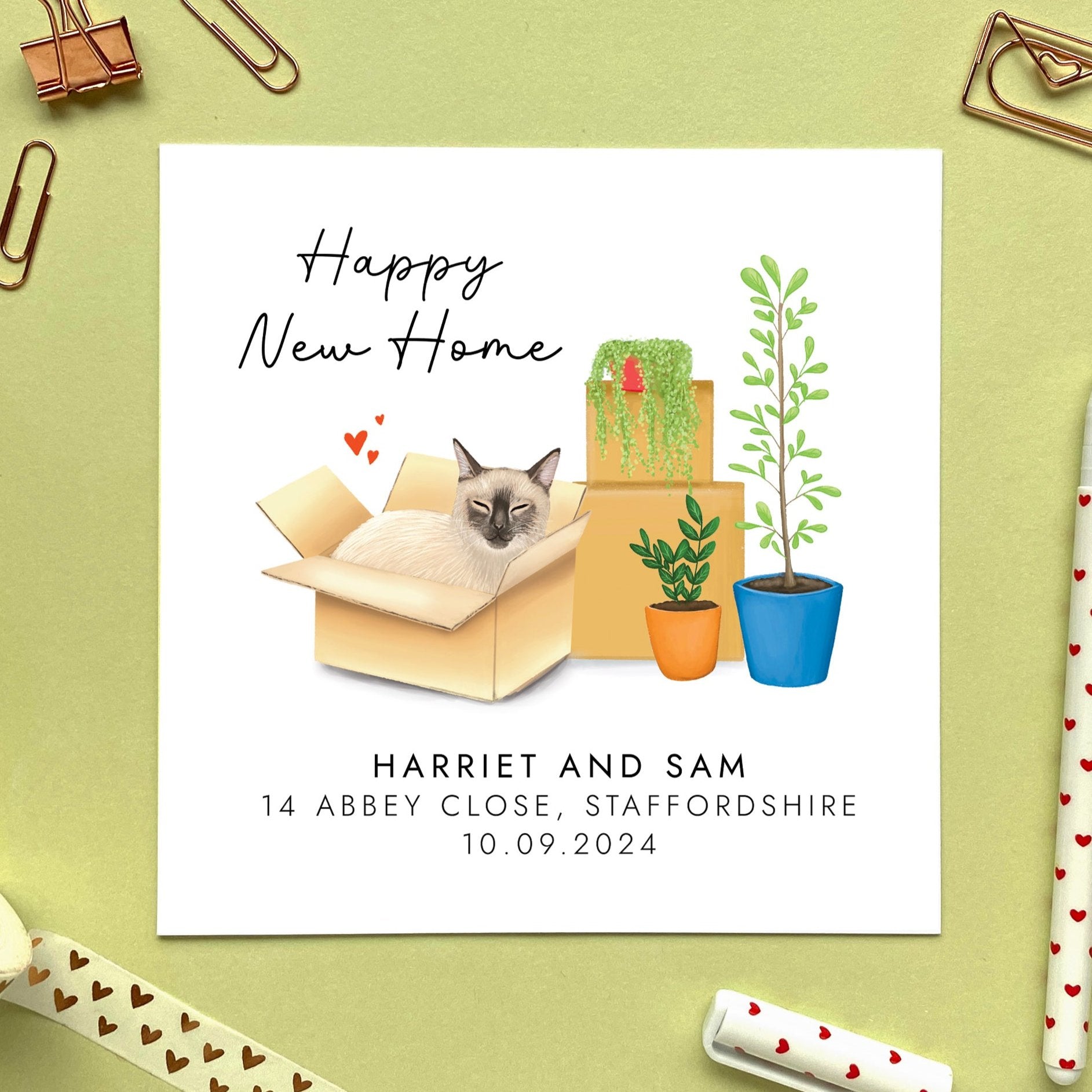 A personalised Happy New Home card featuring a siamese cat in a box.