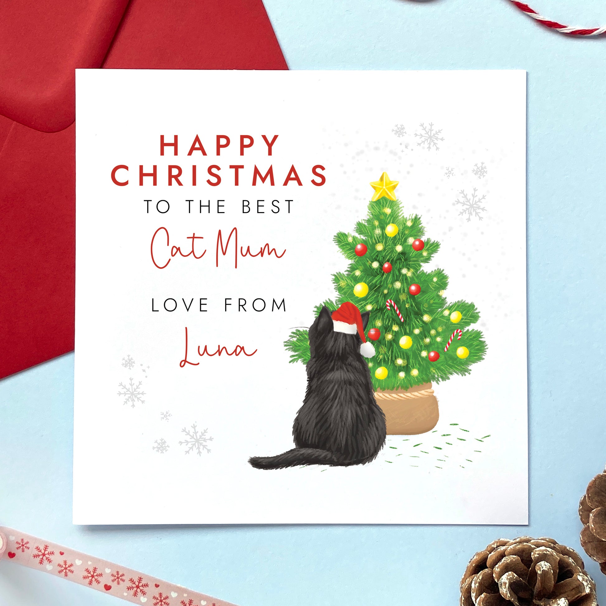 A personalised from the cat christmas card for cat mum. It can be personalised by choosing the cat on the card and the cat's name. The card in the photo is a black cat christmas card.