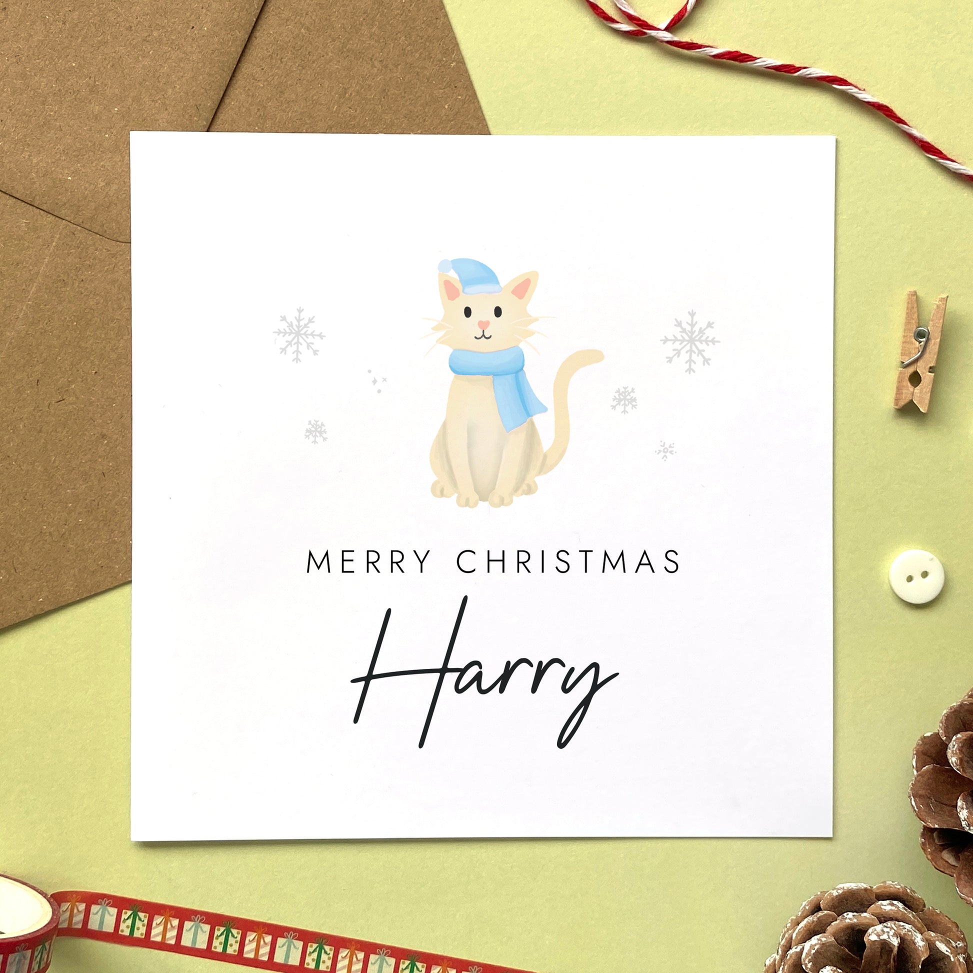 A personalised Christmas card for Him featuring a cream cat. It can be personalised by adding a name or relation. It's designed as a special Christmas card for male relations such as Son, Husband, Brother, Grandson and Dad.