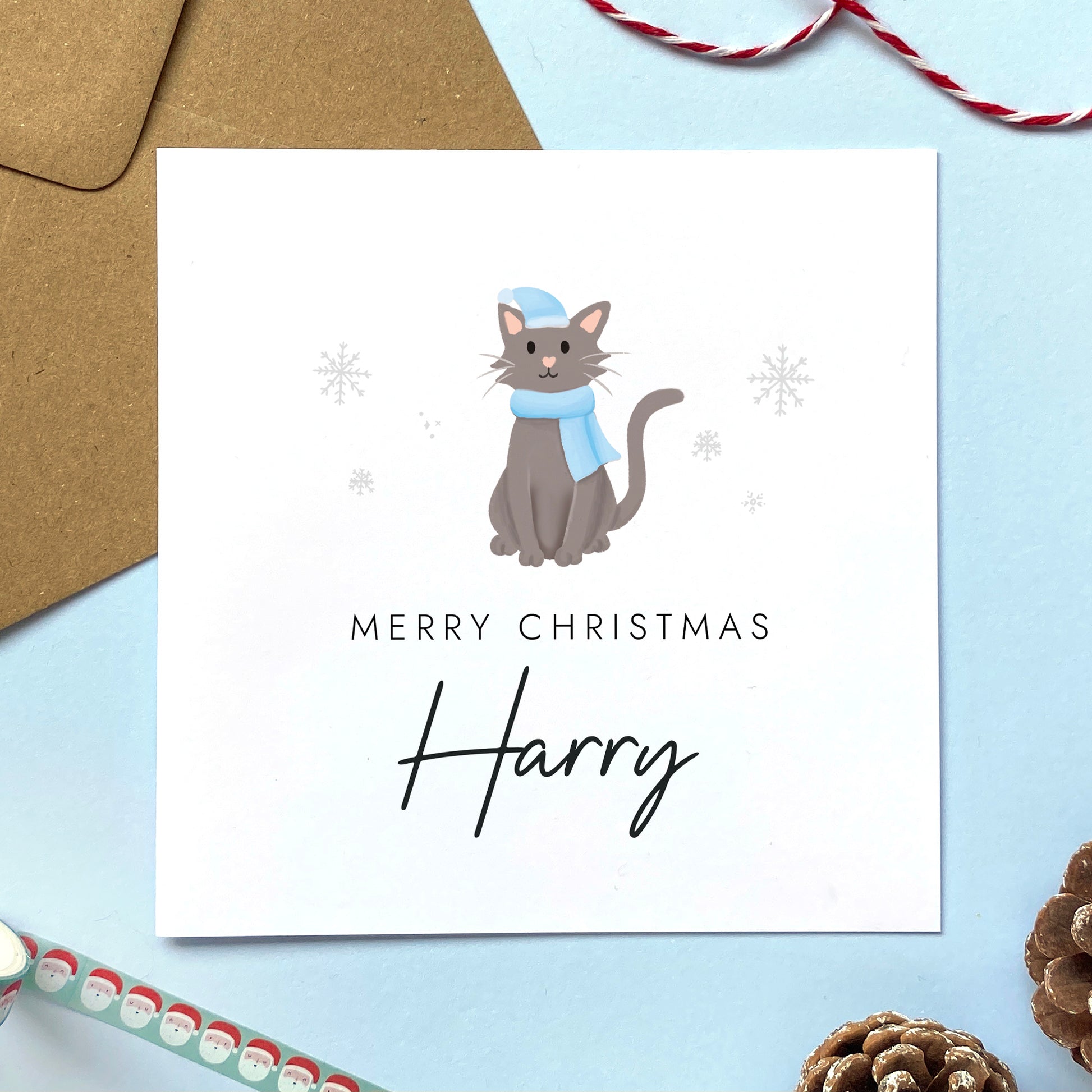A personalised Christmas card for Him featuring a dark grey cat. It can be personalised by adding a name or relation. It's designed as a special Christmas card for male relations such as Son, Husband, Brother, Grandson and Dad.