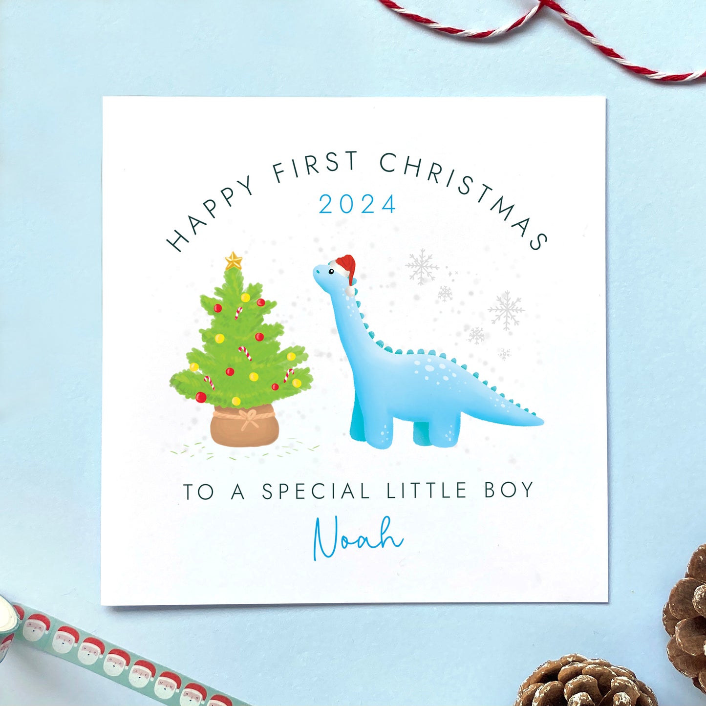 A personalised Dinosaur 1st Christmas Card for Boy, for baby's first christmas.