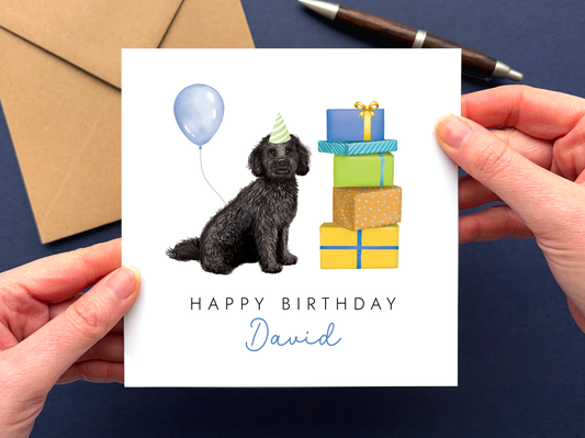 A personalised dog birthday card for him featuring a black cockapoo.