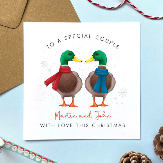 A personalised duck Christmas card for a special Couple. It can be personalised with the couple's names. It features a pair of mallard ducks both male for two men, or a gay couple.