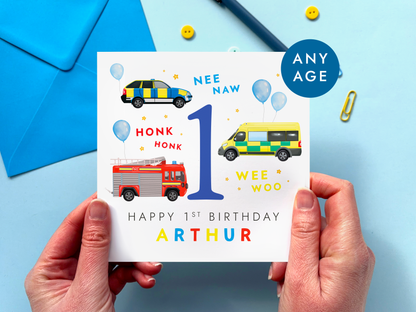 Personalised 1st birthday card for boys with an emergency services vehicles theme - featuring an ambulance, police car and fire engine