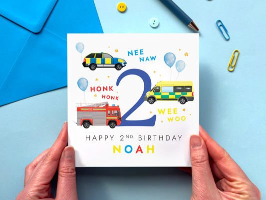 Personalised 2nd birthday card for boys with an emergency services vehicles theme - featuring an ambulance, police car and fire engine