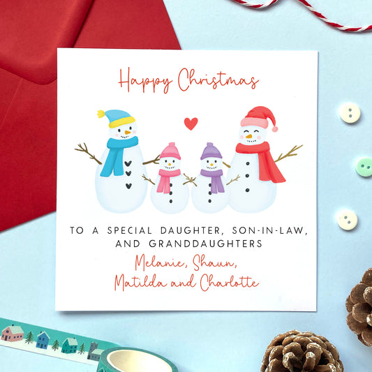 A personalised Christmas card for Daughter, Son-in-Law and two Granddaughters.
