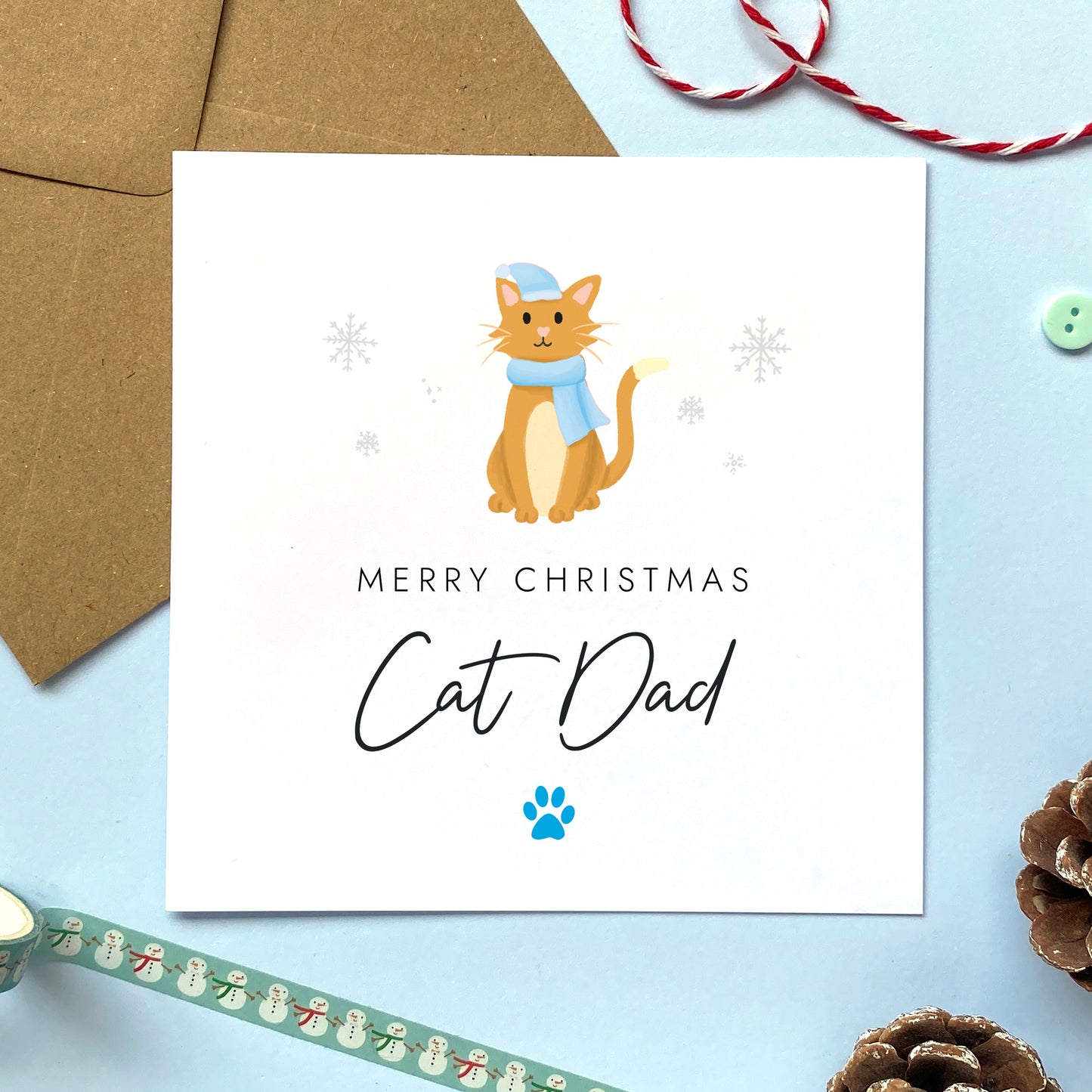 A personalised Christmas card for Cat Dad featuring a ginger and white cat. It can be personalised by changing the relation and the cat. It's designed as a special Christmas card from the cat.
