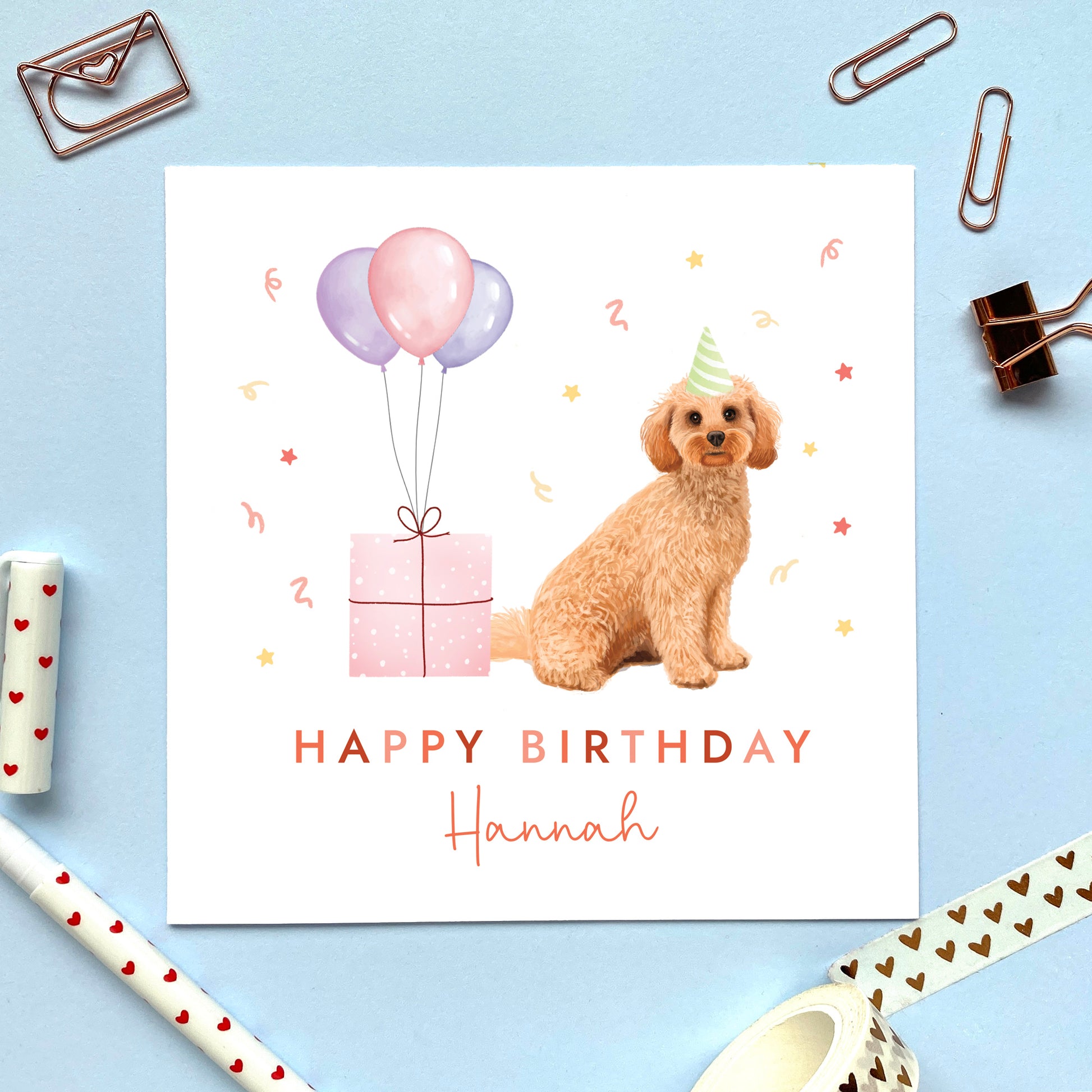 A personalised dog birthday card for her featuring a golden cockapoo. It can be personalised with any name and age. The card in the photo is for a lady.