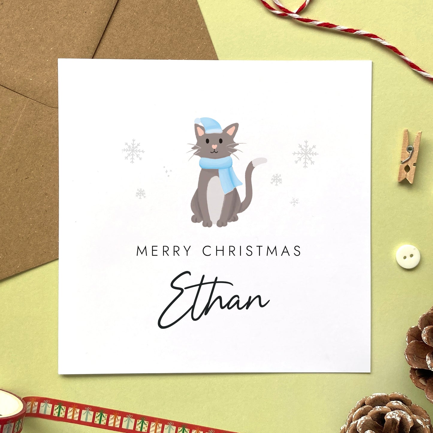 A personalised Christmas card for Him featuring a grey and white cat. It can be personalised by adding a name or relation. It's designed as a special Christmas card for male relations such as Son, Husband, Brother, Grandson and Dad.
