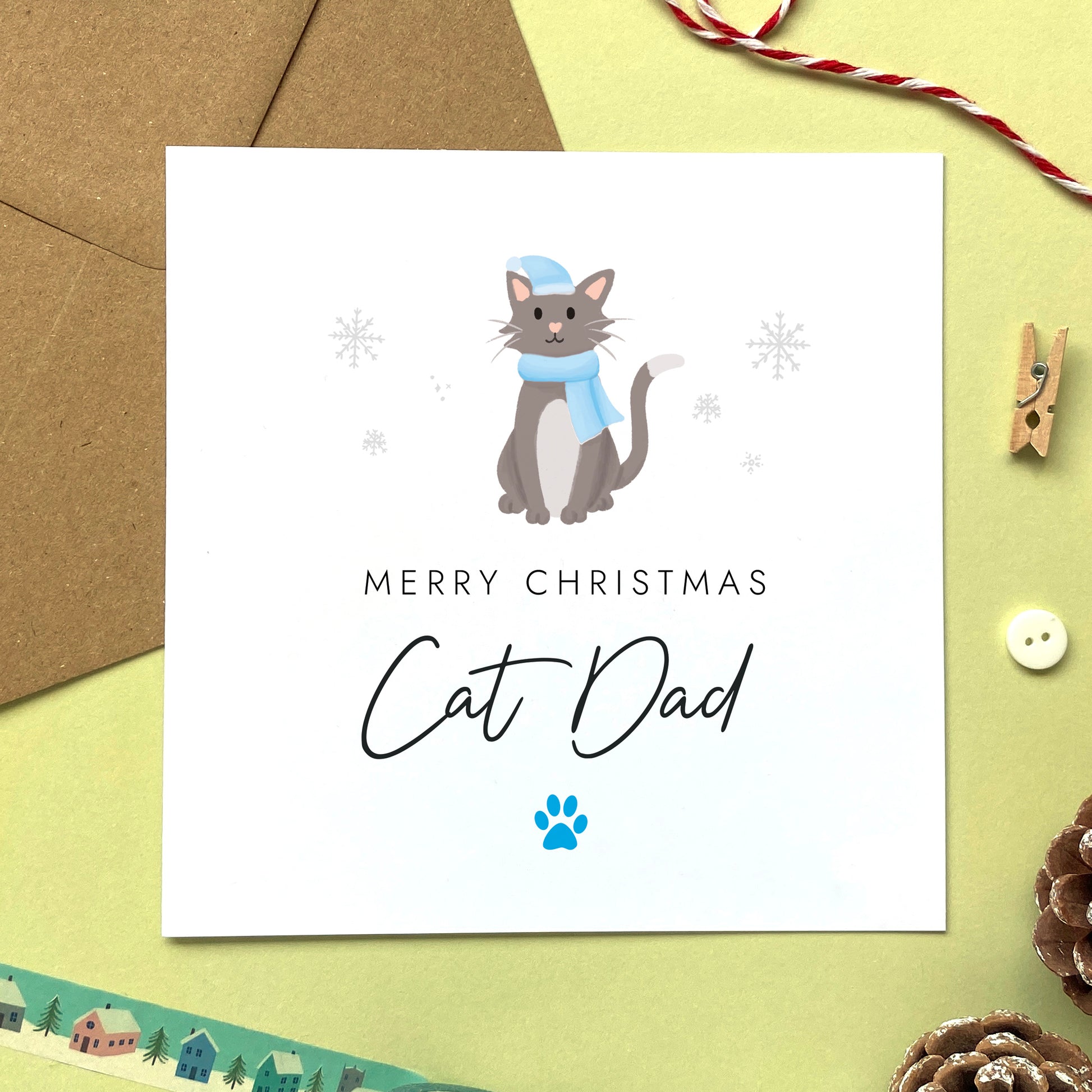 A personalised Christmas card for Cat Dad featuring a grey and white cat. It can be personalised by changing the relation and the cat. It's designed as a special Christmas card from the cat.