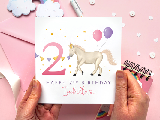 Personalised Horse 2nd Birthday Card for Girl - handdrawn design featuring a white horse with the number 2 and pink and purple balloons