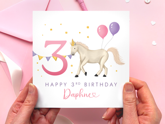 Personalised Horse 3rd Birthday Card for Girl - a handdrawn design featuring a white horse with pink and purple balloons and the number 3