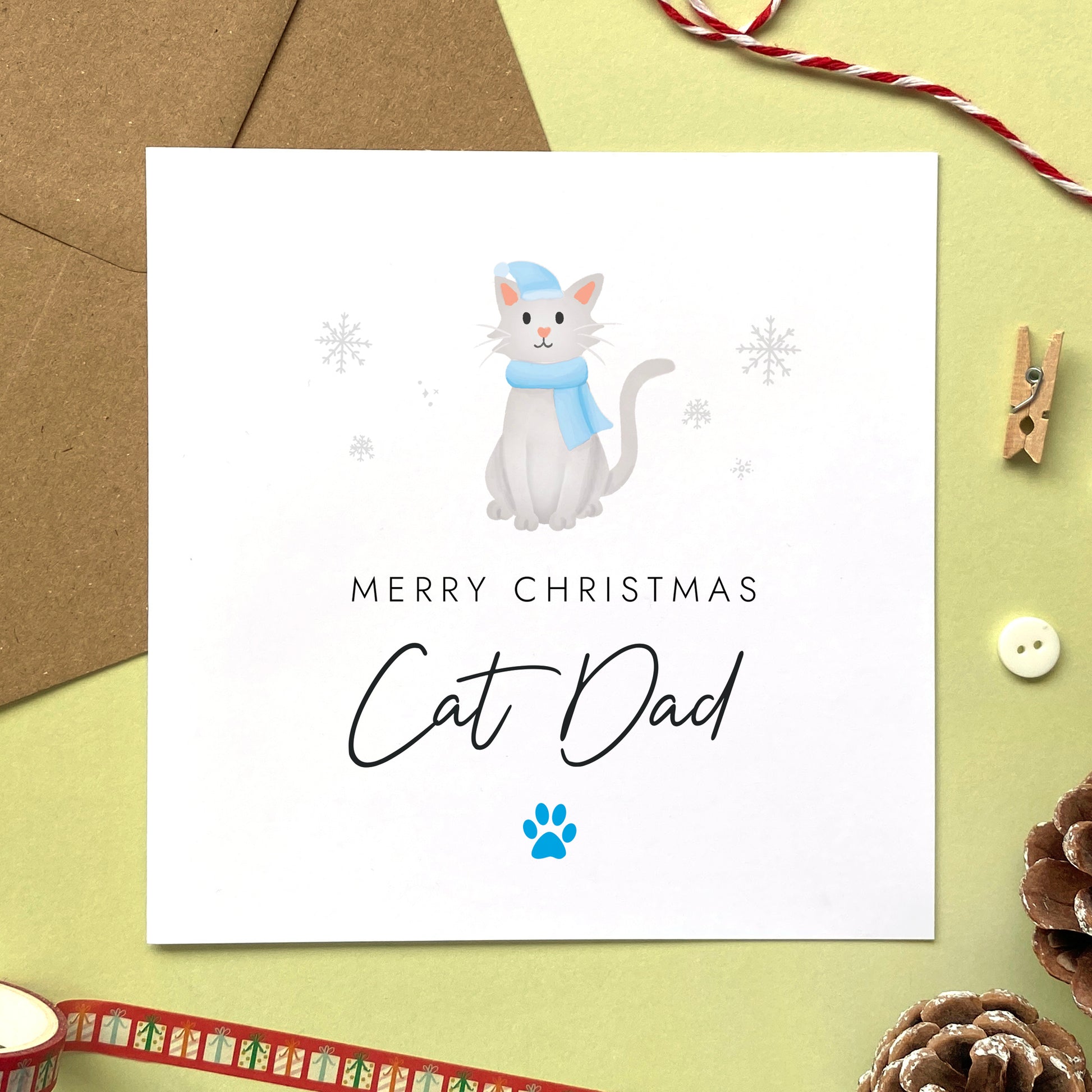 A personalised Christmas card for Cat Dad featuring a light grey cat. It can be personalised by changing the relation and the cat. It's designed as a special Christmas card from the cat.