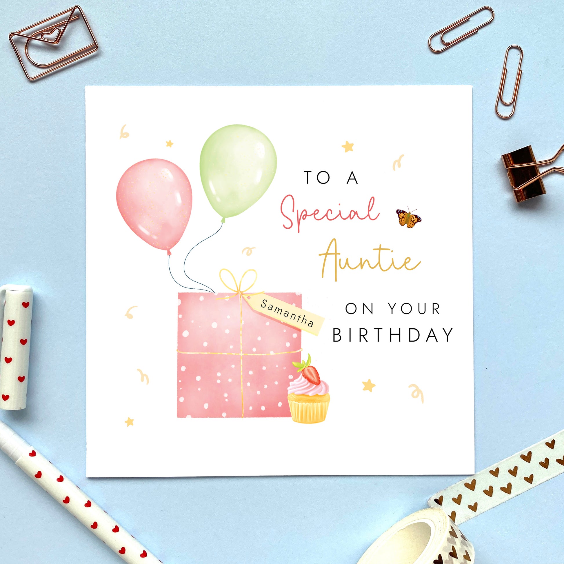 A special personalised birthday card for Auntie, featuring a pink present, pink and green balloons, and a strawberry cupcake. It's suitable for any Aunt, Aunty or Great Auntie. The age can be changed to any number, such as 18th, 21st, 30th, 40th and 50th.