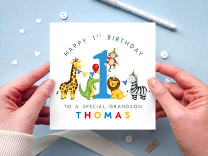 Personalised 1st birthday card for Grandson featuring bright and colourful safari animals, around the number 1