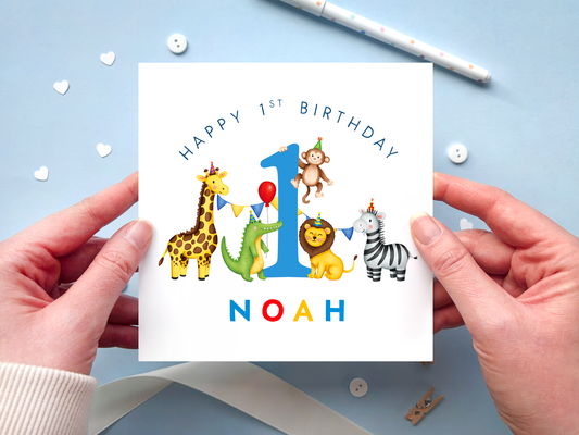 Personalised 1st birthday card for boy featuring bright and colourful safari animals, around the number 1