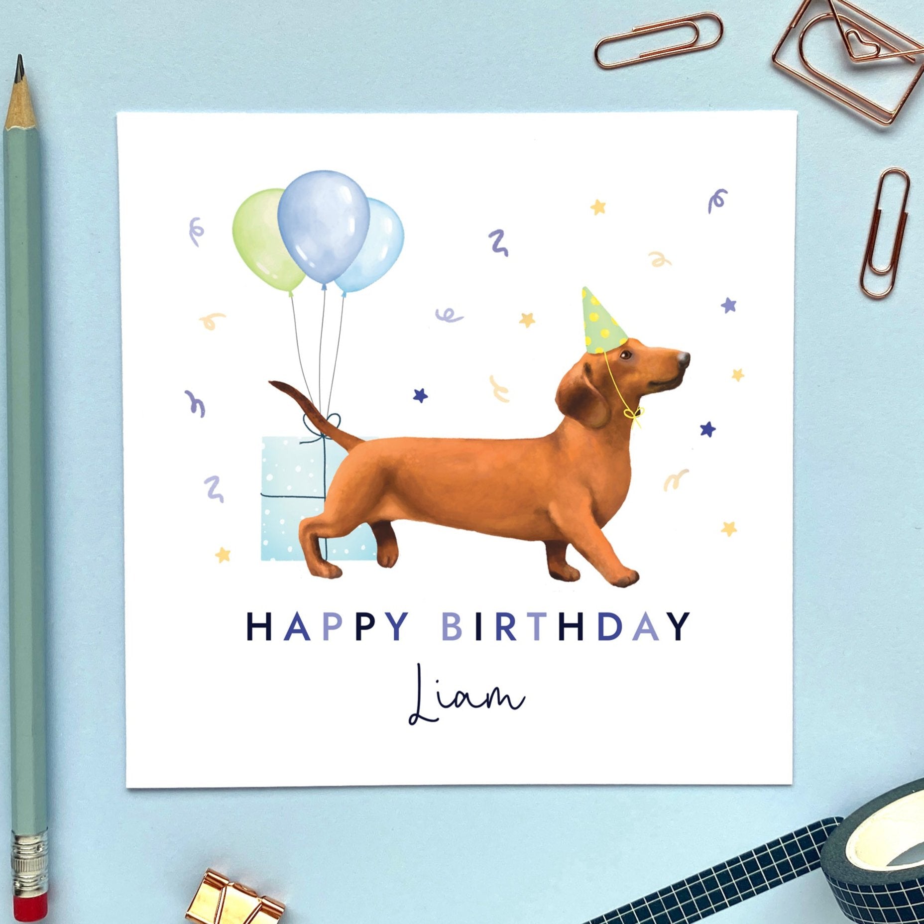 A personalised dog birthday card for him featuring a sausage dog (Dachshund). It can be personalised with any name and age.
