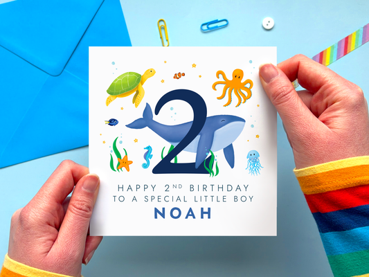 personalised sealife themed 2nd birthday card for a special ilittle boy with ocean creatures around the number 2