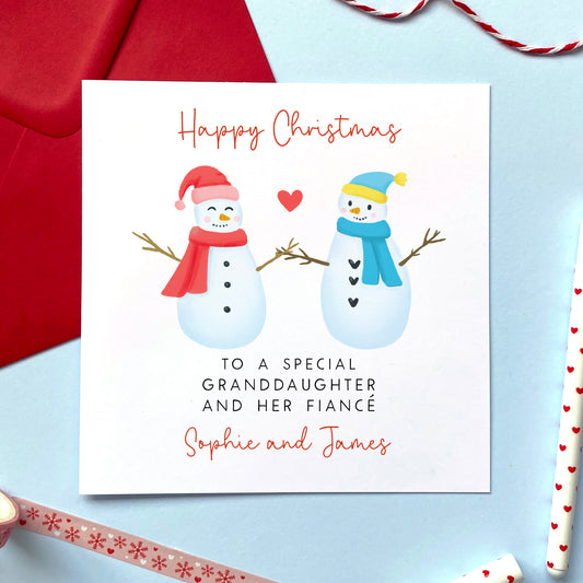 A personalised snowman couple Christmas card for a special Granddaughter and her Fiancé. 