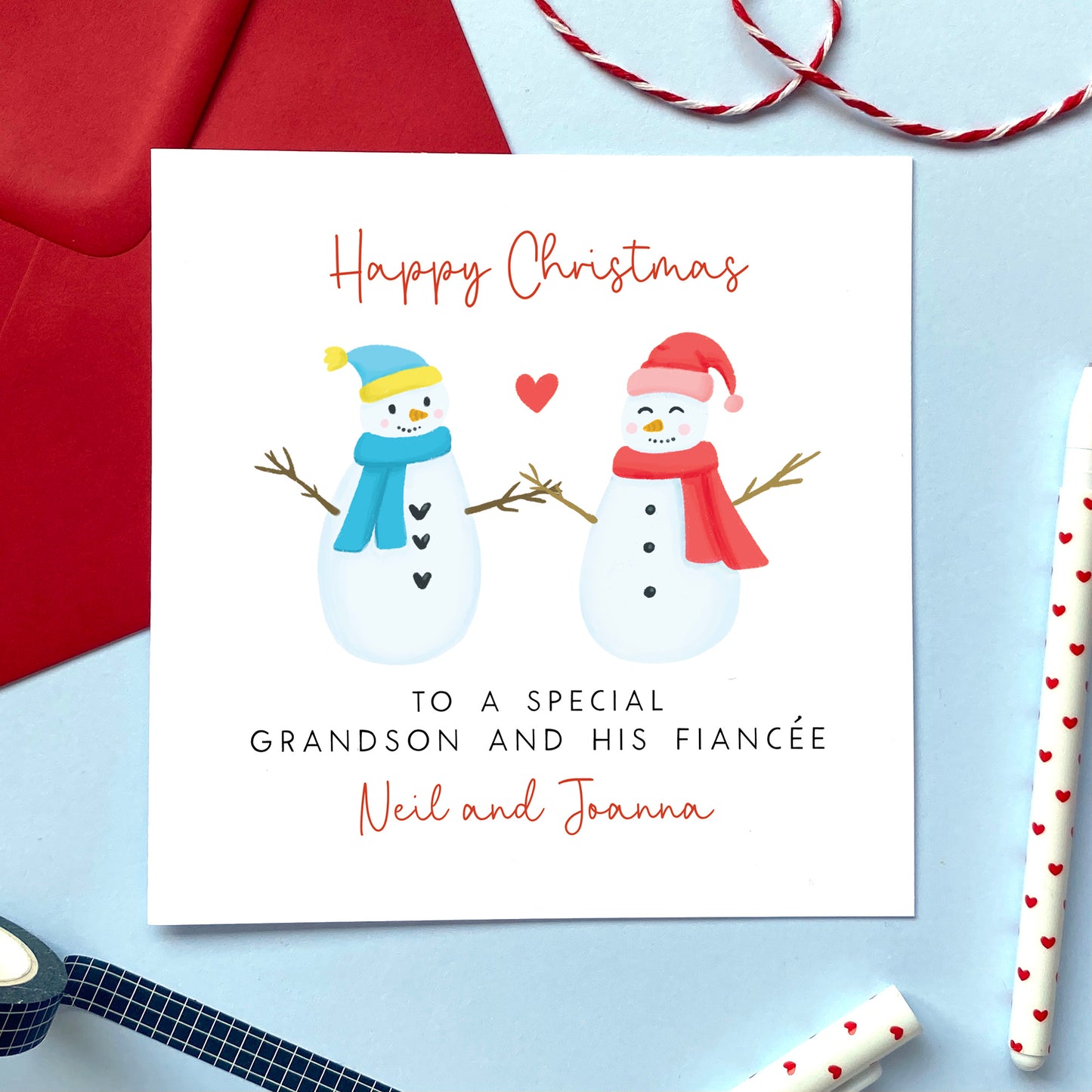 A personalised snowman couple Christmas card for Grandson and his Fiancée. 