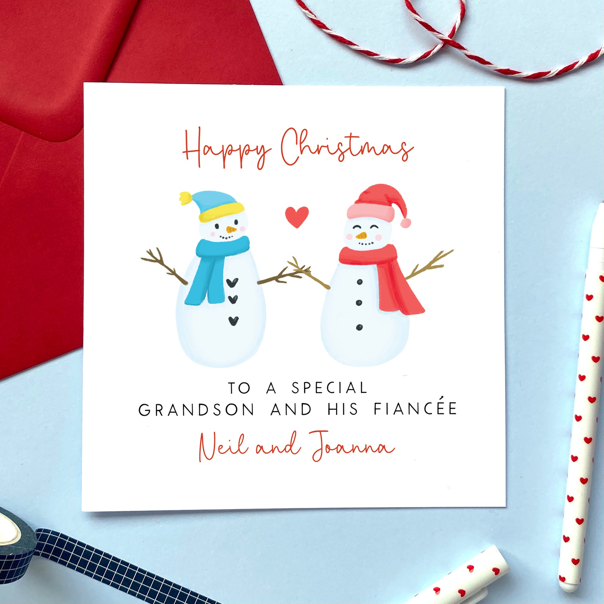 A personalised snowman couple Christmas card for Grandson and his Fiancée. 