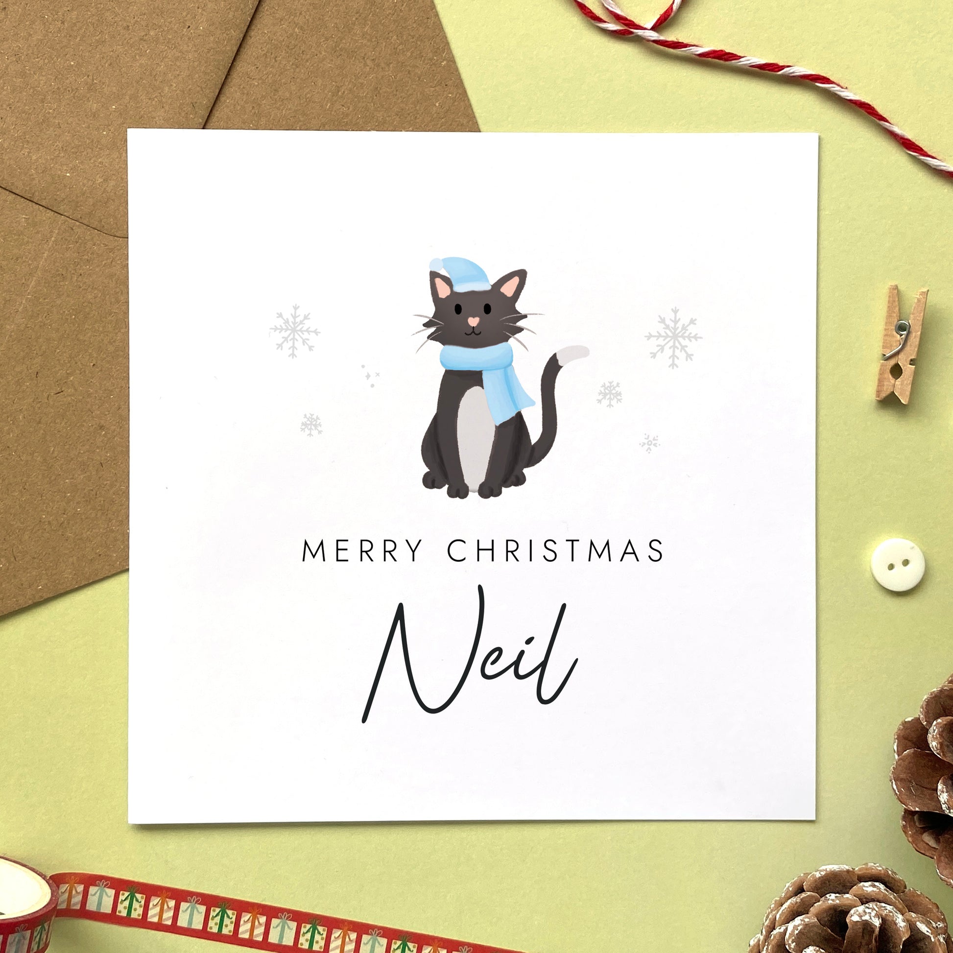 A personalised Christmas card for Him featuring a black and white tuxedo cat. It can be personalised by adding a name or relation. It's designed as a special Christmas card for male relations such as Son, Husband, Brother, Grandson and Dad.